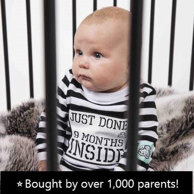 Baby in cot jail wearing prison baby grow Just Done 9 Months Inside